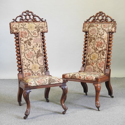 Lot 723 - A pair of Victorian carved walnut prie dieu chairs