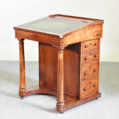 Lot 559 - A Victorian walnut davenport, with a fitted...