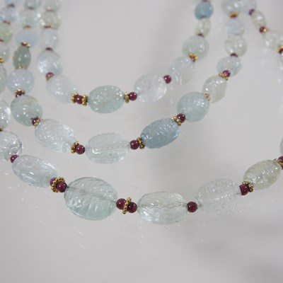 Lot 63 - A carved stone bead necklace, together with two other bead necklaces