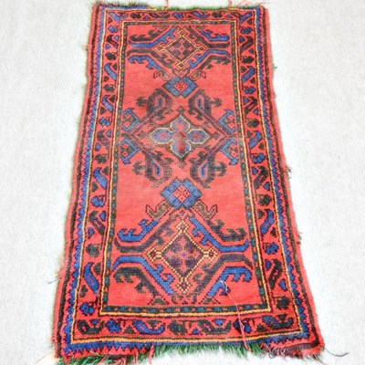 Lot 96 - A Persian rug, with three hooked medallions,...