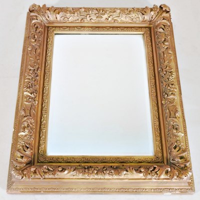 Lot 597 - An ornate 19th century gilt framed wall mirror,...