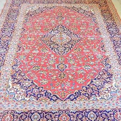 Lot 495 - A large Persian carpet, with foliate designs...