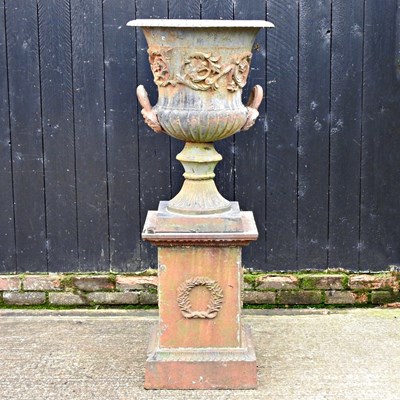 Lot 31 - A large black painted cast iron garden urn, of...