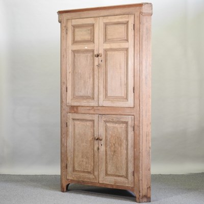 Lot 483 - A 19th century pine standing corner cupboard