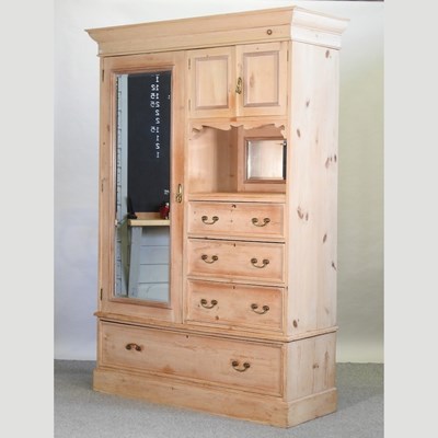 Lot 485 - A 19th century pine combination wardrobe