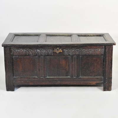 Lot 511 - An 18th century panelled oak coffer, with a...