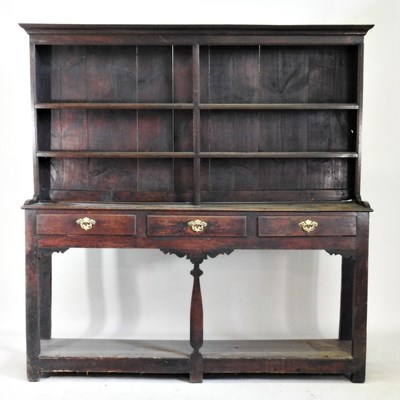 Lot 290 - An 18th century oak dresser, with a boarded...