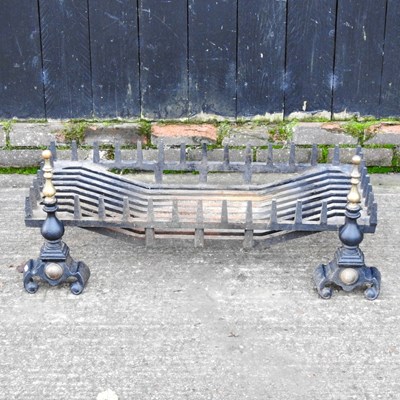 Lot 460 - A cast iron fire grate, 92cm wide, together...