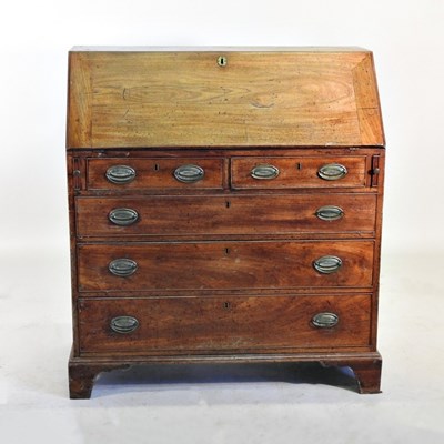 Lot 211 - A George III mahogany bureau, on bracket feet