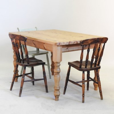 Lot 498 - A pine kitchen table, together with three...