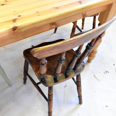Lot 498 - A pine kitchen table, together with three...