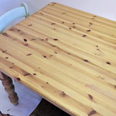 Lot 498 - A pine kitchen table, together with three...