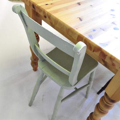Lot 498 - A pine kitchen table, together with three...