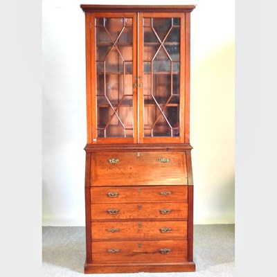 Lot 386 - An Edwardian astragal glazed bureau cabinet,...