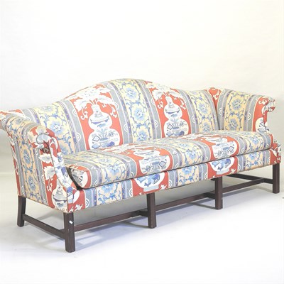 Lot 580 - A George III style floral upholstered hump back sofa