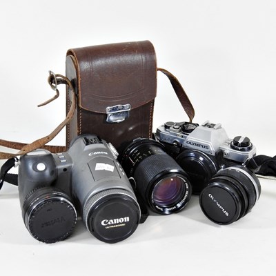 Lot 426 - An Olympus CM10 camera, together with a Canon...