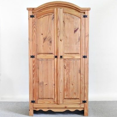 Lot 276 - A modern pine double wardrobe, enclosed by...