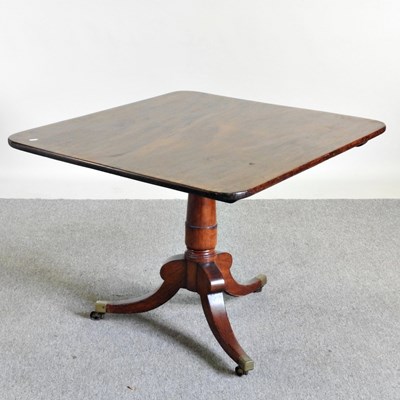 Lot 339 - A Regency mahogany dining table, with a hinged...