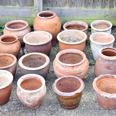 Lot 309 - A collection of terracotta garden pots,...