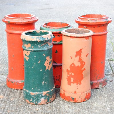 Lot 298 - A collection of five red painted chimney pots (5)