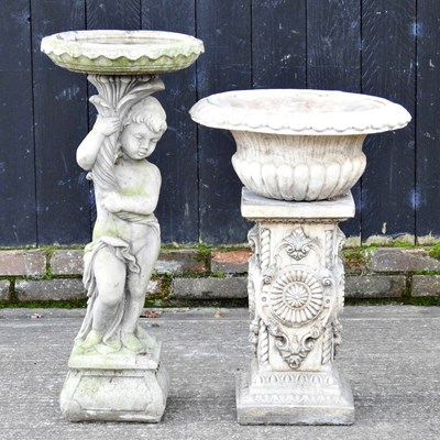 Lot 412 - A cast stone garden urn, 74cm high, together...