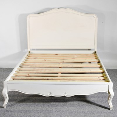 Lot 266 - A white painted double bedstead, with a...