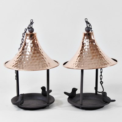 Lot 103 - A pair of garden bird feeders, each with a...