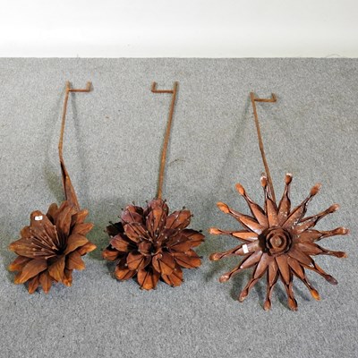 Lot 167 - Three rusted flower head plant supports, each...