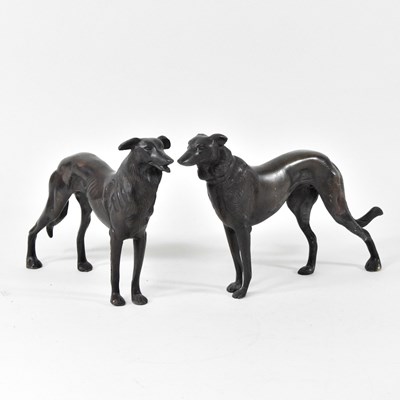 Lot 157 - A pair of bronze models of dogs, shown...