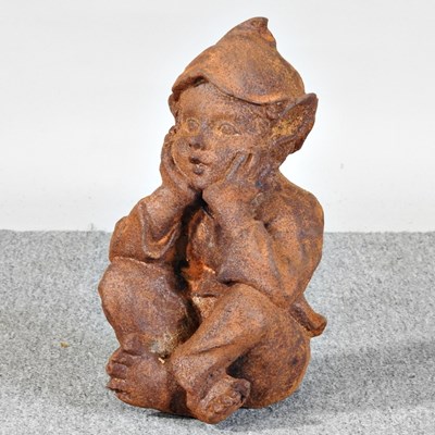 Lot 243 - A rusted garden figure of a goblin, 34cm high