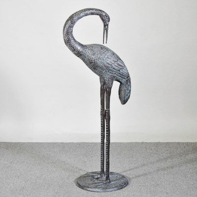 Lot 244 - A large cast metal garden sculpture of a crane,...