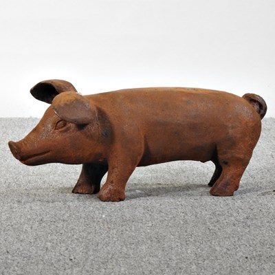 Lot 200 - A rusted cast iron model of a pig, 43cm long