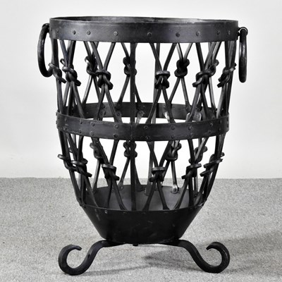 Lot 70 - A modern wrought iron log basket