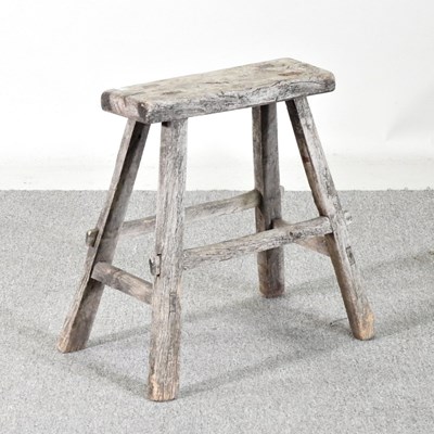 Lot 497 - A rustic small wooden stool