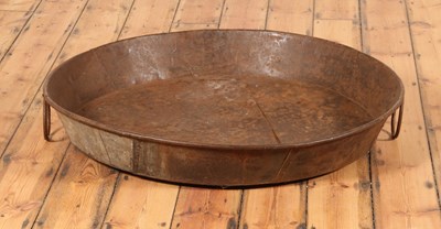 Lot 455 - A large circular metal cooking pan, having...