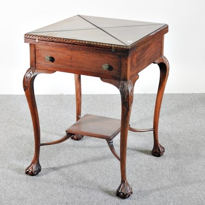 Lot 264 - An Edwardian envelope card table, on claw and...