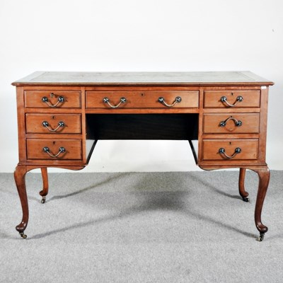 Lot 151 - An early 20th century mahogany kneehole desk,...