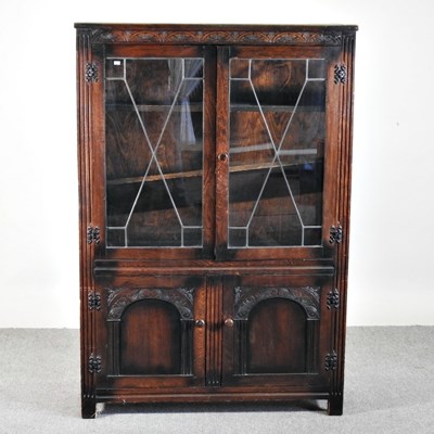 Lot 576 - A mid 20th century glazed oak bookcase