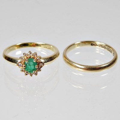 Lot 145 - An 18 carat gold, emerald and diamond cluster...