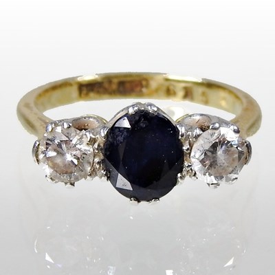 Lot 170 - An 18 carat gold, sapphire and diamond three...