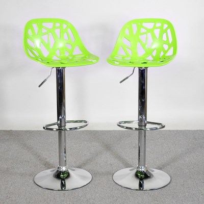 Lot 79 - A pair of modern chrome bar stools, with green...