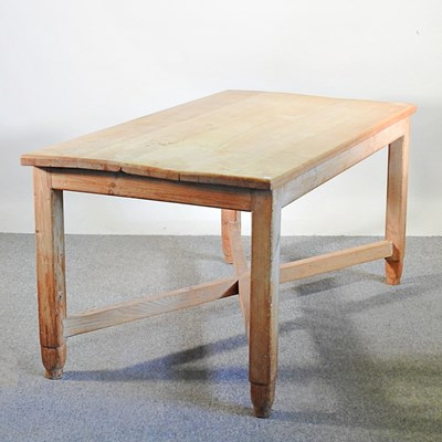 Lot 133 - A pine farmhouse dining table, with an x-frame...