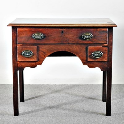 Lot 560 - An 18th century mahogany lowboy, on square legs