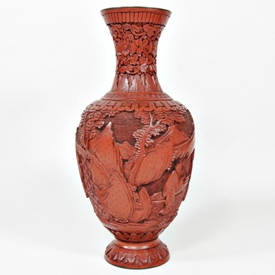 Lot 409 - A Chinese carved cinnabar lacquer vase, 26cm high