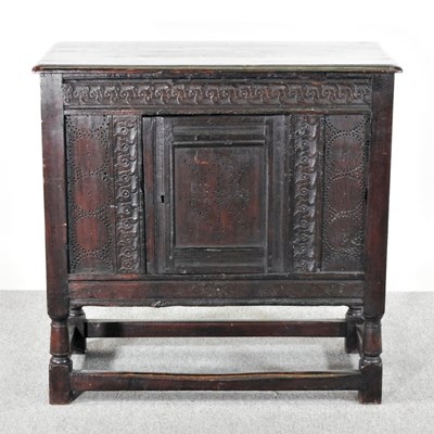 Lot 206 - An 18th century carved oak side cabinet, on...