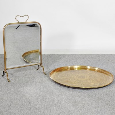 Lot 554 - A large Indian brass tray, together with a...