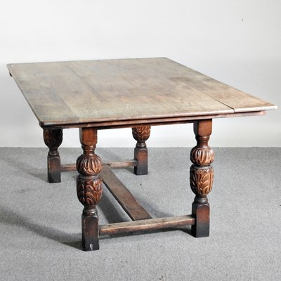 Lot 416 - An early 20th century oak dining table, of...