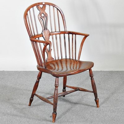 Lot 147 - A 19th century elm seated windsor chair, on...