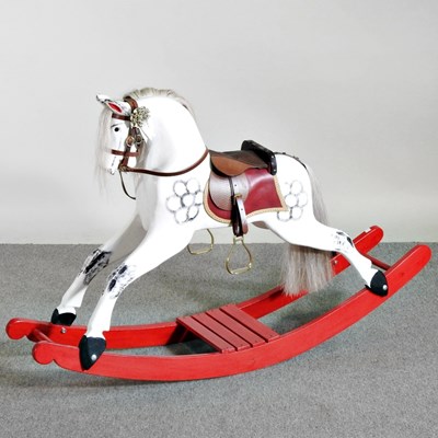 Lot 497 - A painted wooden bay rocking horse, on a bowed...