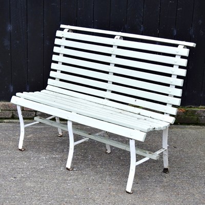 Lot 24 - A French grey painted wooden garden bench, on...